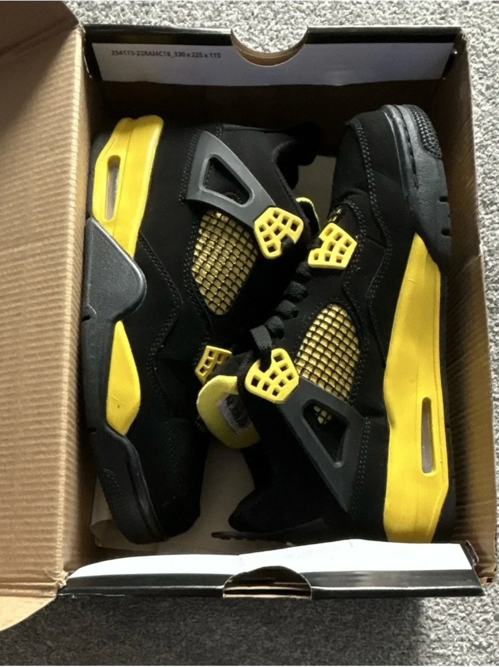 Jordan Retro 4 Black and Yellow Sneakers